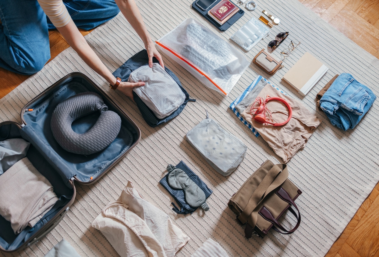 Woman Packing A Suitcase