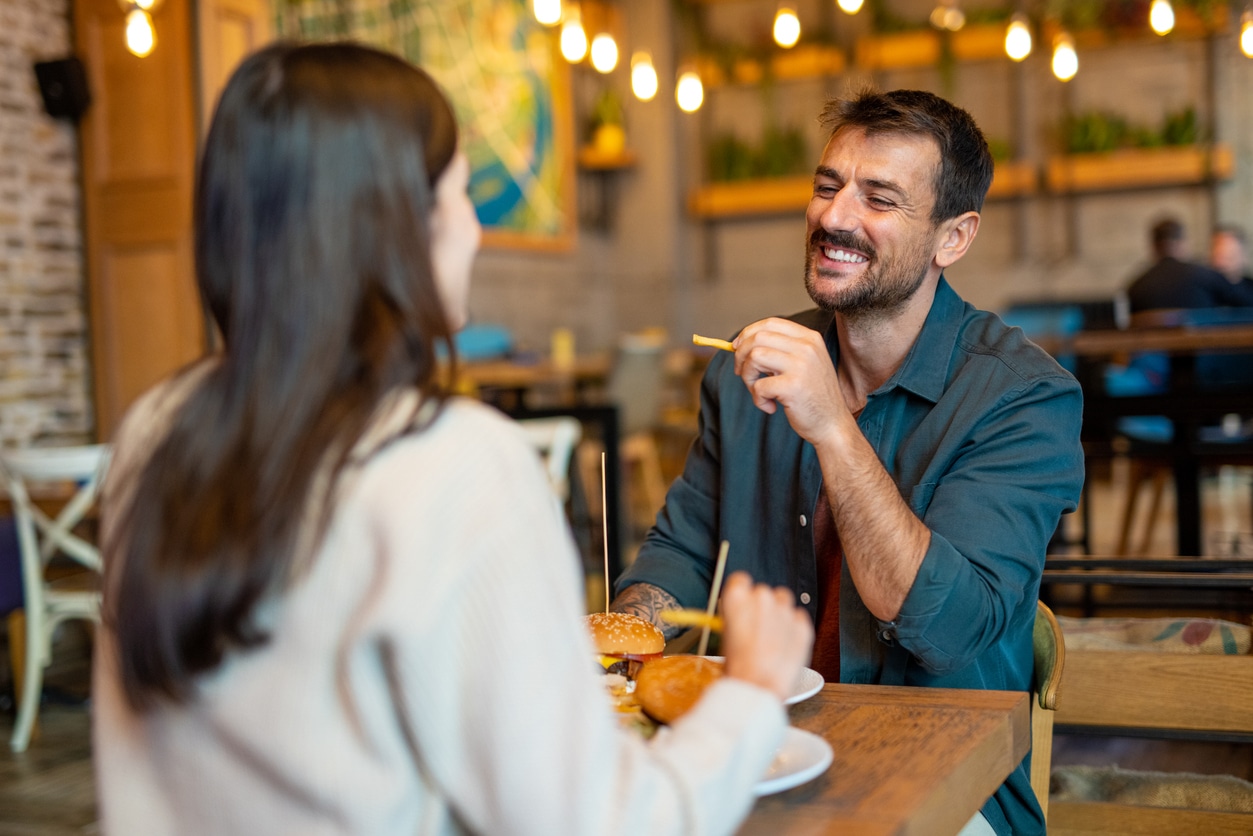 Smiling couple having lunch.